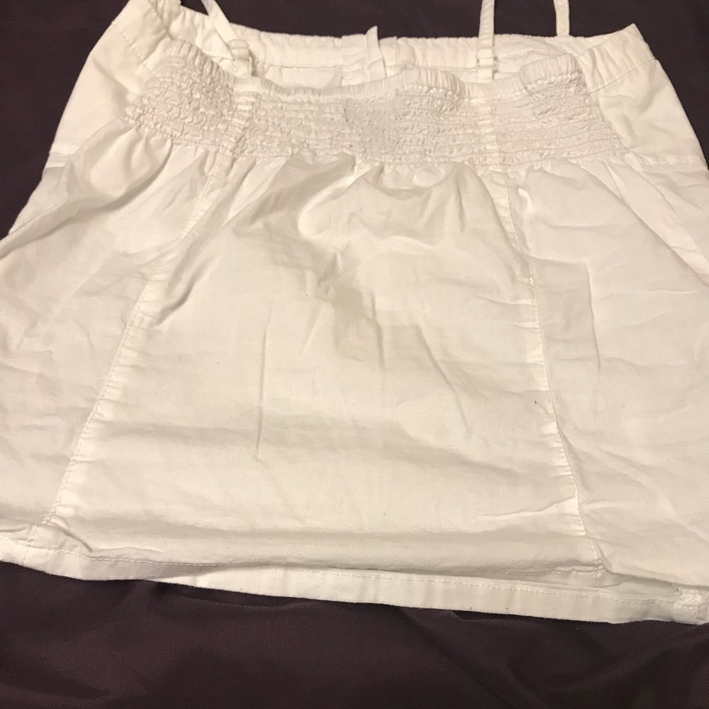 White shirt with buttons.